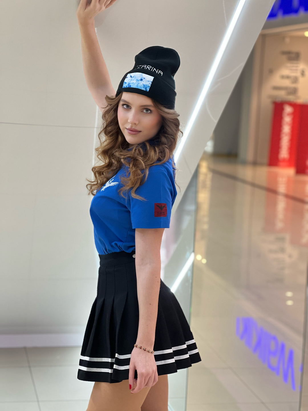 Czarina Sasha (@sashastarynets) is wearing a Black Beanie with blue sky design and white embroidered CZARINA from Czar Clothing