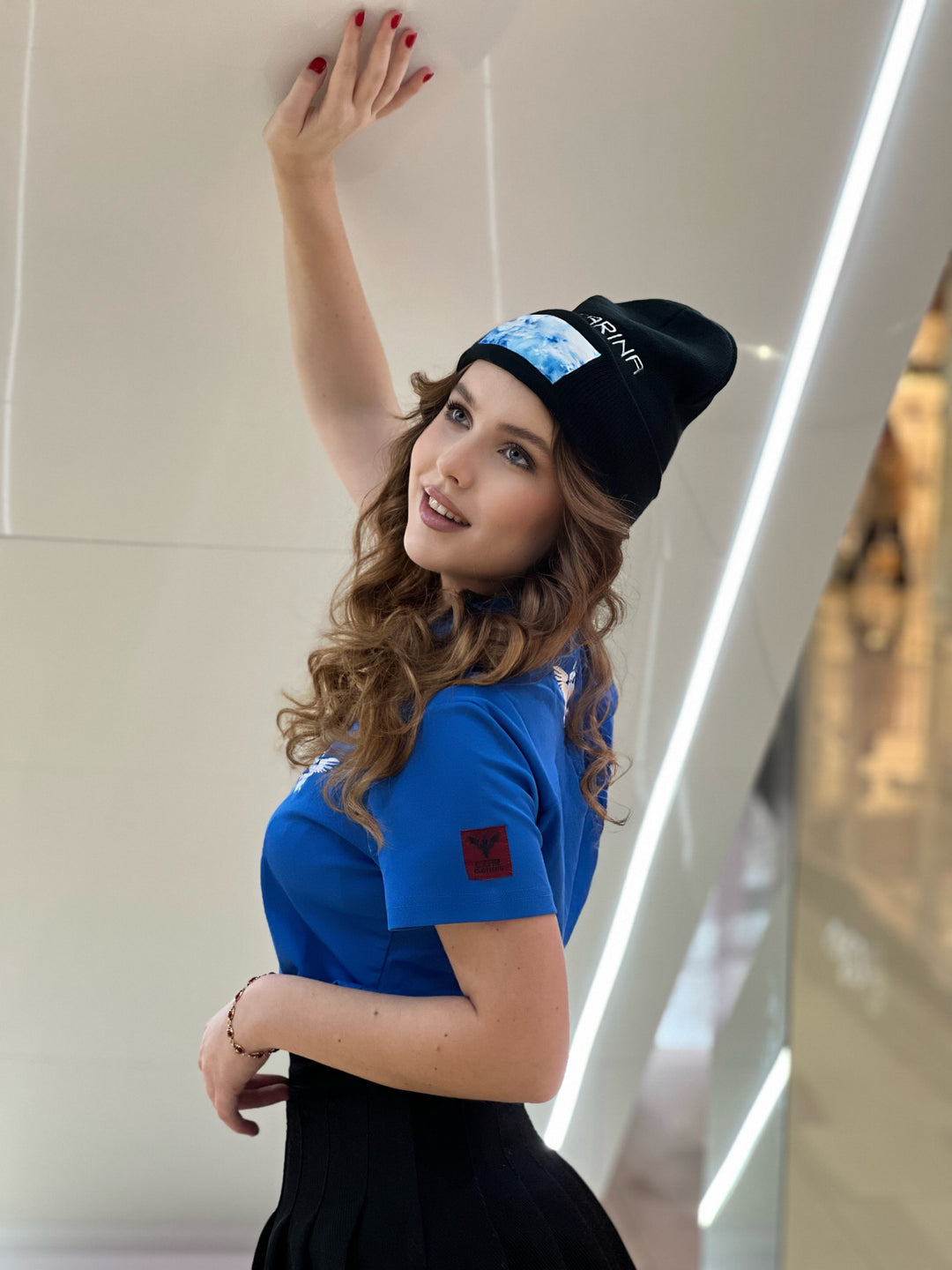 Czarina Sasha (@sashastarynets) is wearing a Black Beanie with blue sky design and white embroidered CZARINA from Czar Clothing