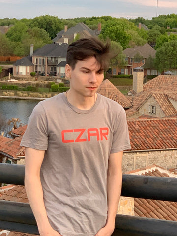 Czar Gunnar wearing a red czar T-shirt from Czar Clothing